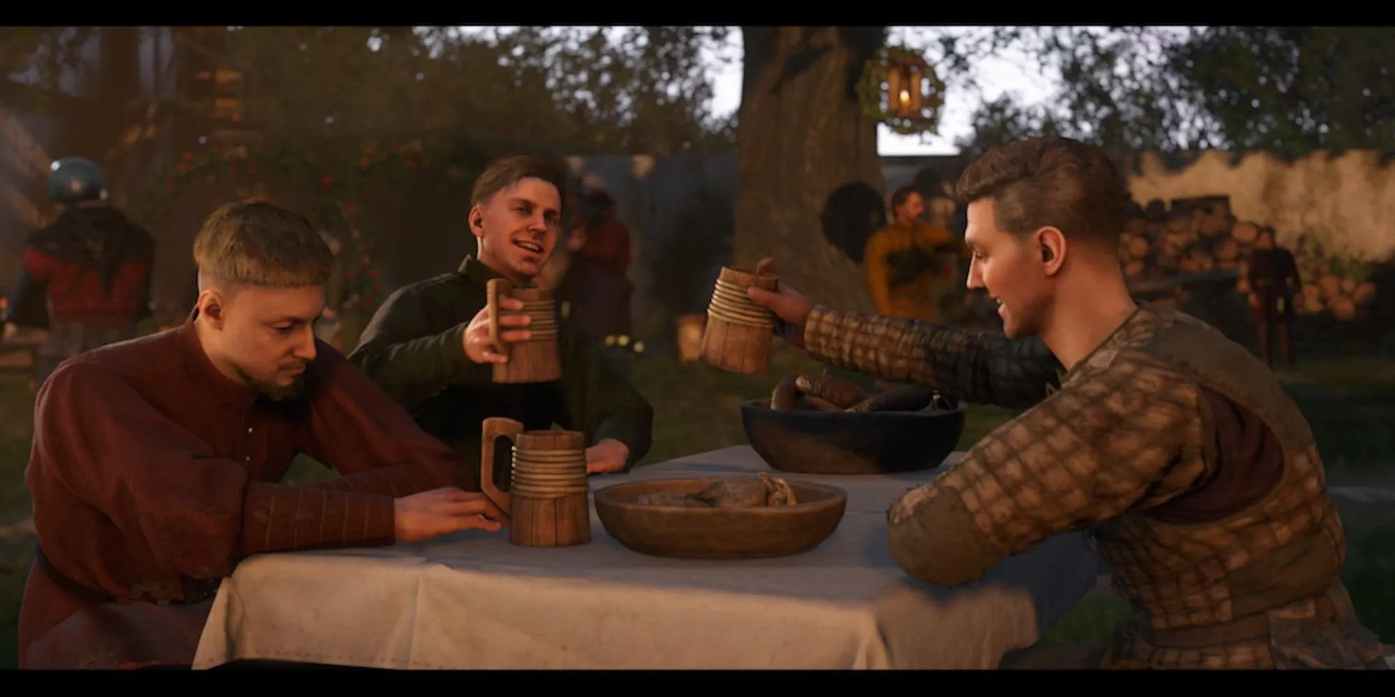 Các nhân vật đang ăn uống và trò chuyện trong một quán rượu thời trung cổ trong Kingdom Come Deliverance 2