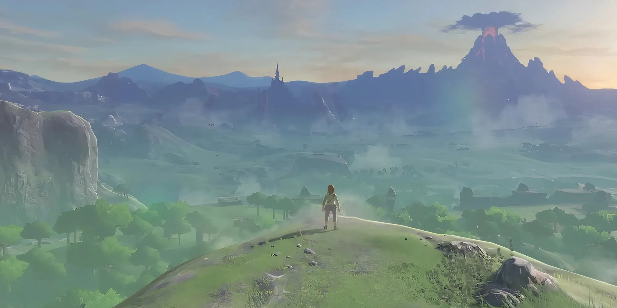 Link đứng trên vách đá nhìn ra thế giới Hyrule rộng lớn trong The Legend of Zelda Breath of the Wild
