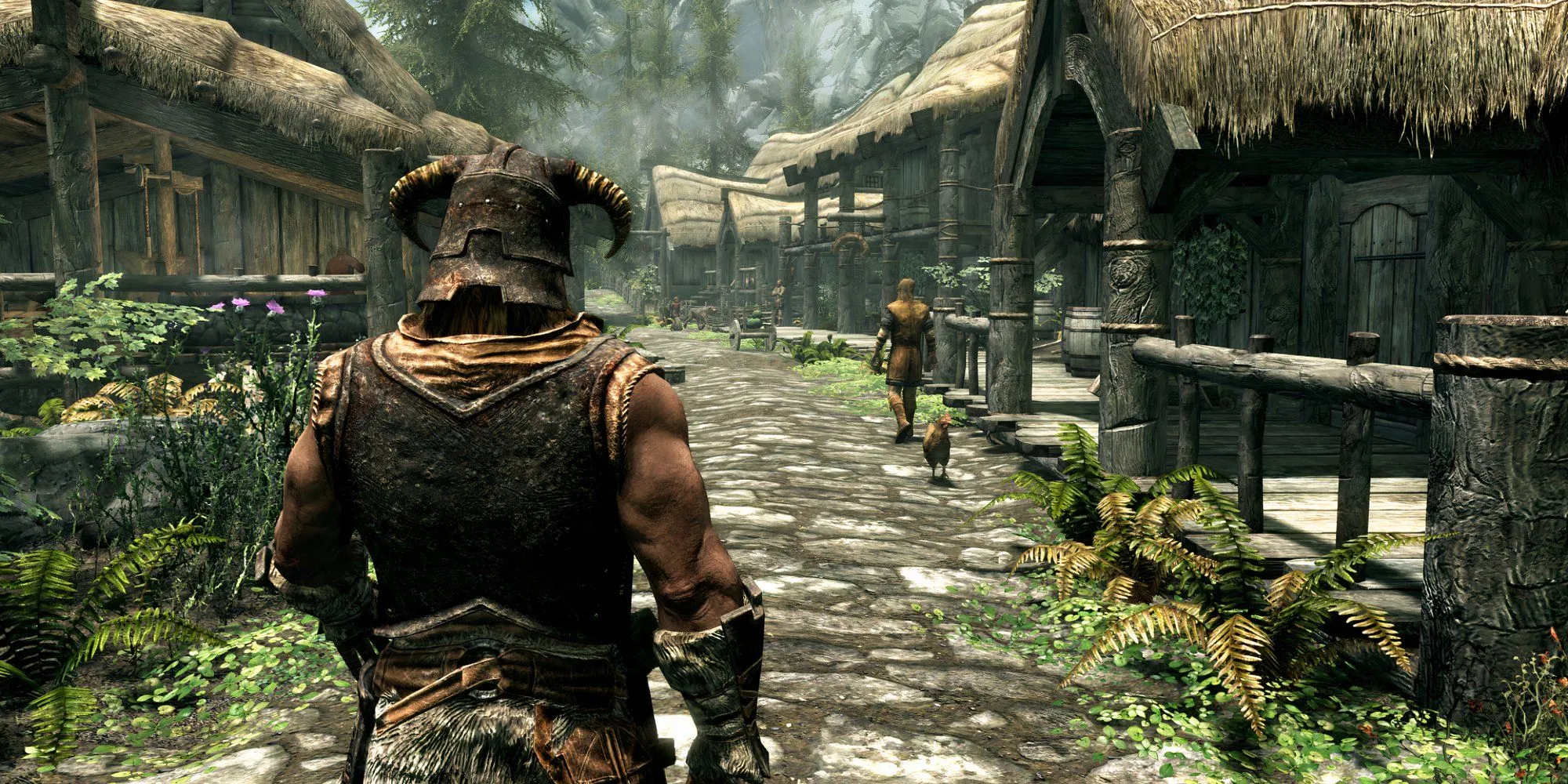 Nhân vật chính trong The Elder Scrolls V: Skyrim nhìn ra một ngôi làng.