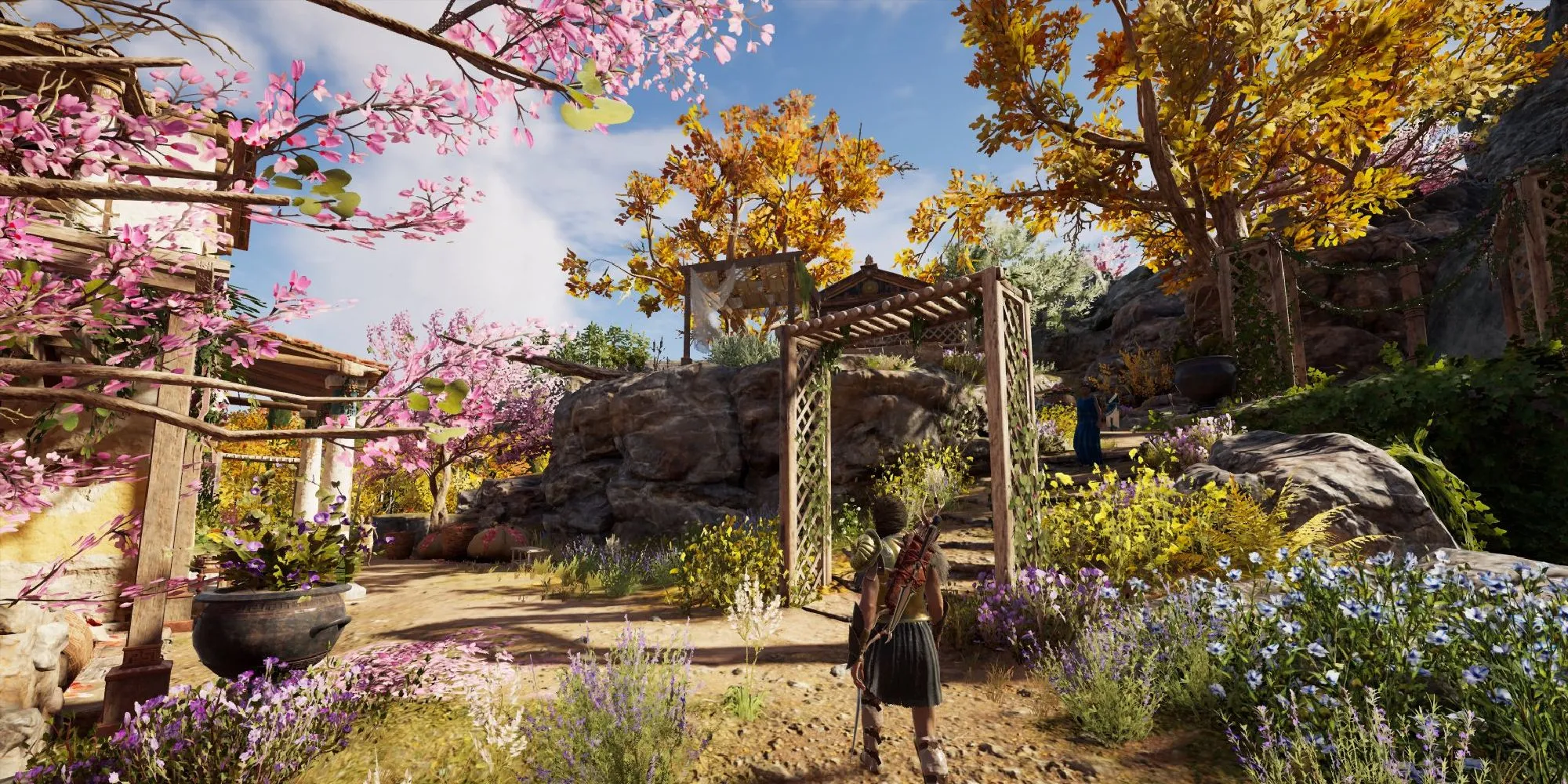 Nhân vật Kassandra trong Assassin's Creed Odyssey đang tiến vào một ngôi làng Hy Lạp cổ đại