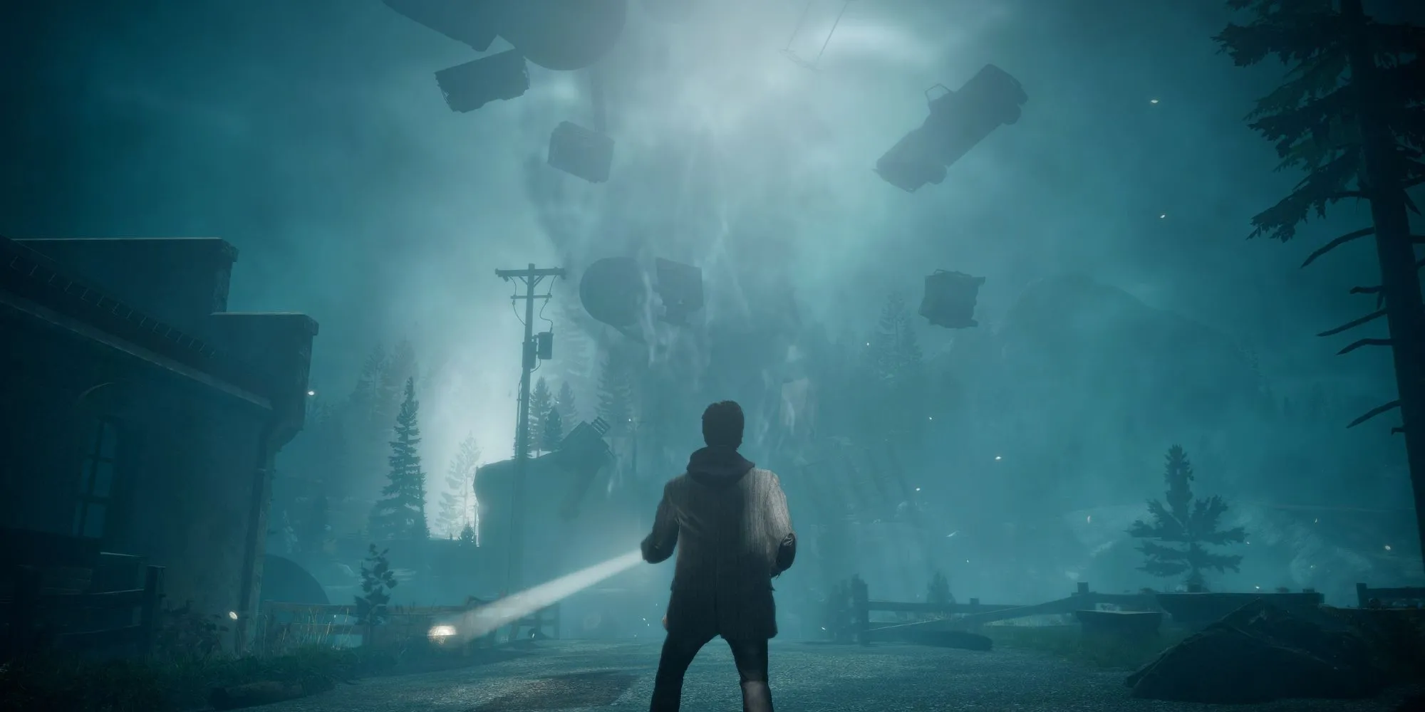 Alan Wake đứng với ngọn đuốc trong một môi trường siêu nhiên và kỳ dị