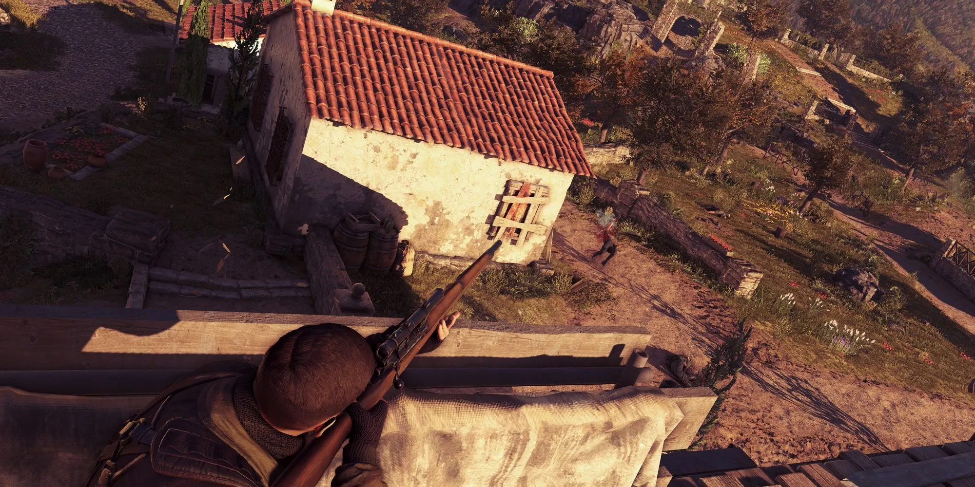 Nhân vật Sniper Elite 4 ẩn nấp trên mái nhà nhắm bắn kẻ thù
