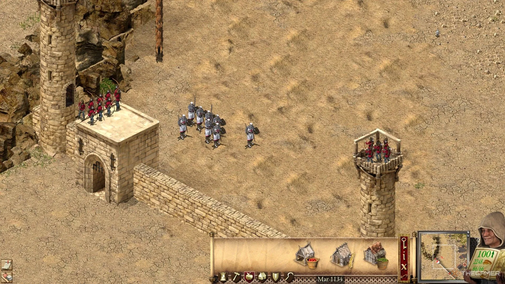 Một đội quân gồm kiếm sĩ và cung thủ phòng thủ cổng thành trong Stronghold Crusader Definitive Edition.